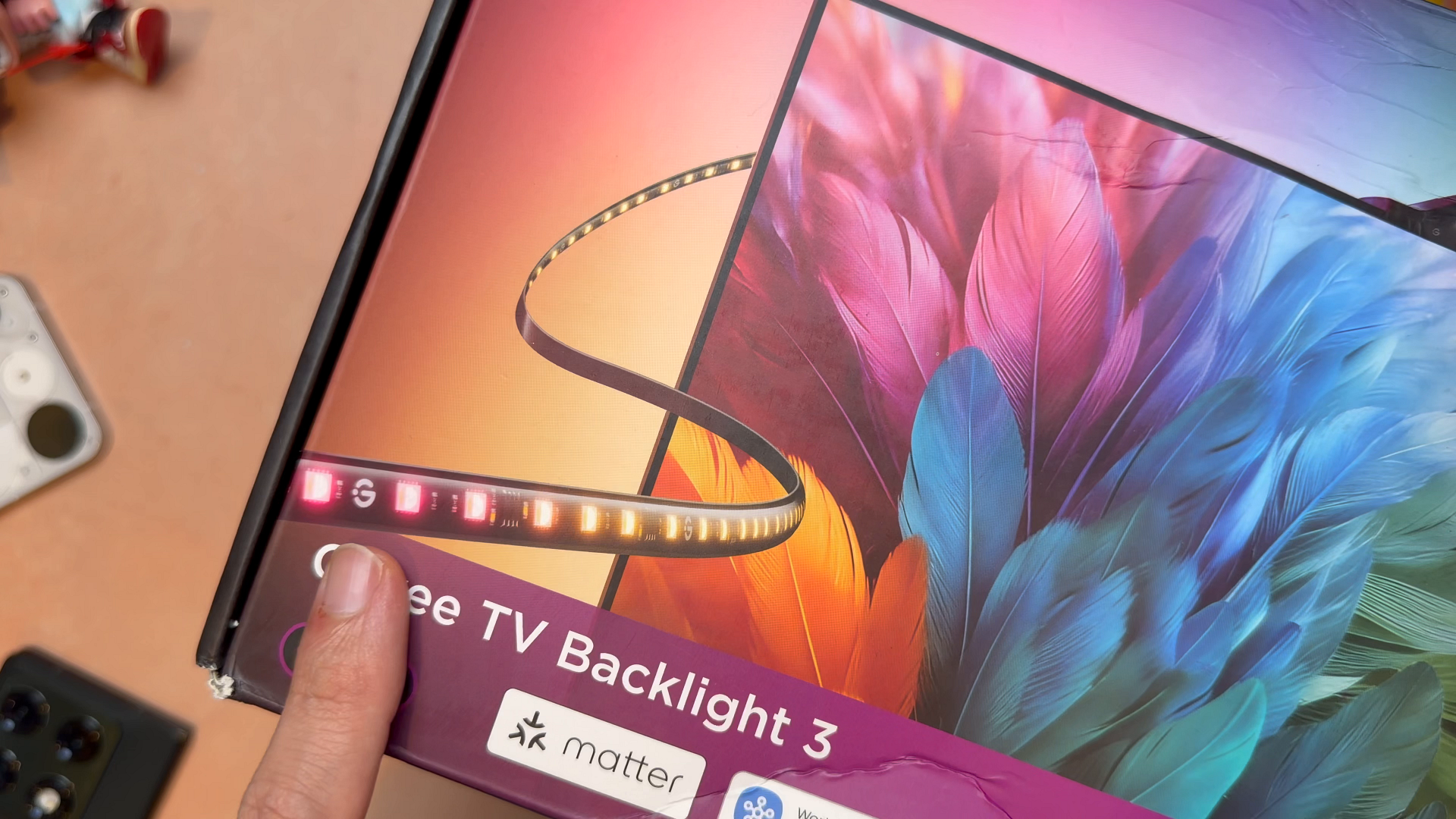 The Govee TV Backlight 3 box showing the dual-camera color sync feature and compatible TV sizes